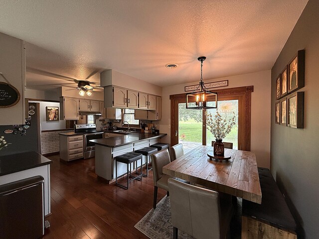 112 Orchard Cir, Montevideo, MN 56265 - dining room with dark wood-style floors and a textured ceiling