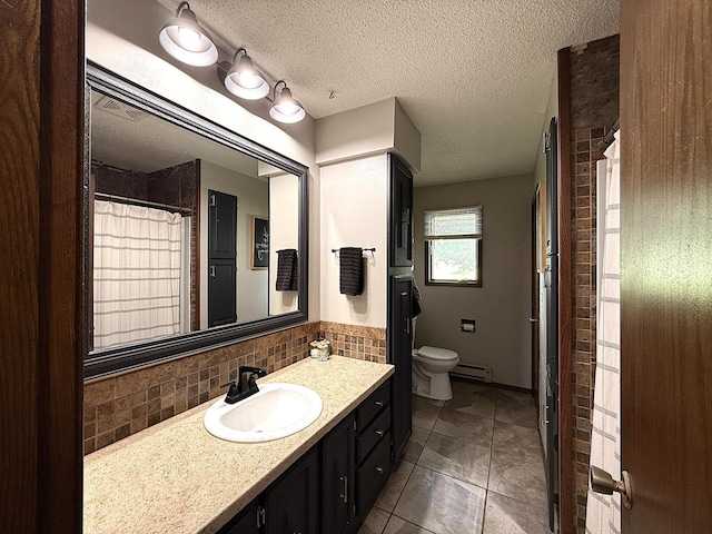 112 Orchard Cir, Montevideo, MN 56265 - bathroom with vanity, baseboard heating, tasteful backsplash, a textured ceiling, and tile patterned flooring