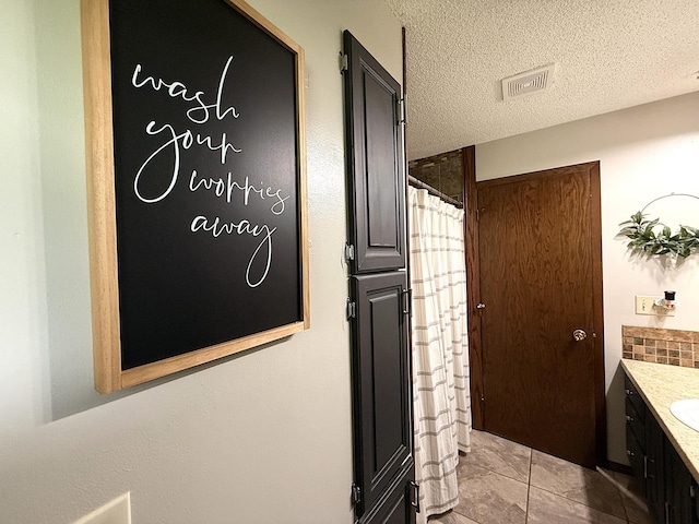 112 Orchard Cir, Montevideo, MN 56265 - hallway with light tile patterned floors and a textured ceiling