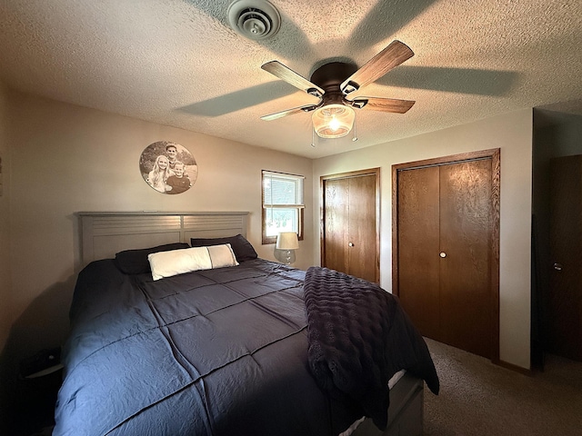 112 Orchard Cir, Montevideo, MN 56265 - bedroom with multiple closets, carpet flooring, a textured ceiling, and ceiling fan