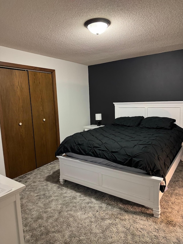 112 Orchard Cir, Montevideo, MN 56265 - carpeted bedroom with a textured ceiling and a closet