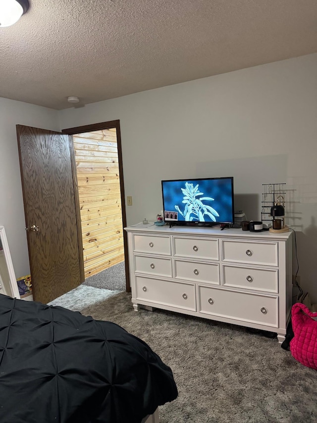 112 Orchard Cir, Montevideo, MN 56265 - bedroom featuring dark colored carpet and a textured ceiling