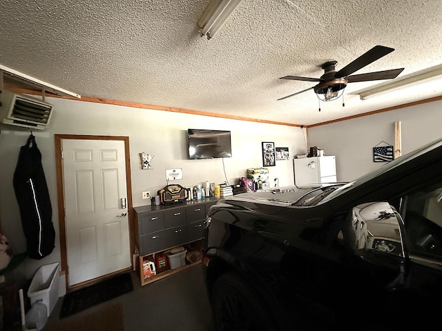 112 Orchard Cir, Montevideo, MN 56265 - garage featuring a ceiling fan, a heating unit, and refrigerator