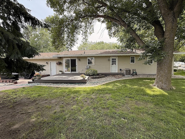 112 Orchard Cir, Montevideo, MN 56265 - back of property featuring a wooden deck and a lawn