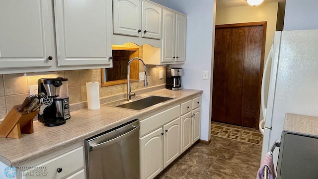 2440 15th St S Unit B14, Fargo, ND 58103 - kitchen with stainless steel dishwasher, range, decorative backsplash, freestanding refrigerator, and light countertops