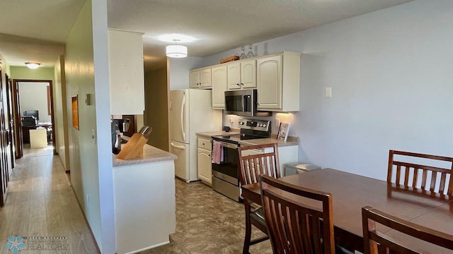2440 15th St S Unit B14, Fargo, ND 58103 - kitchen with stainless steel appliances and light countertops