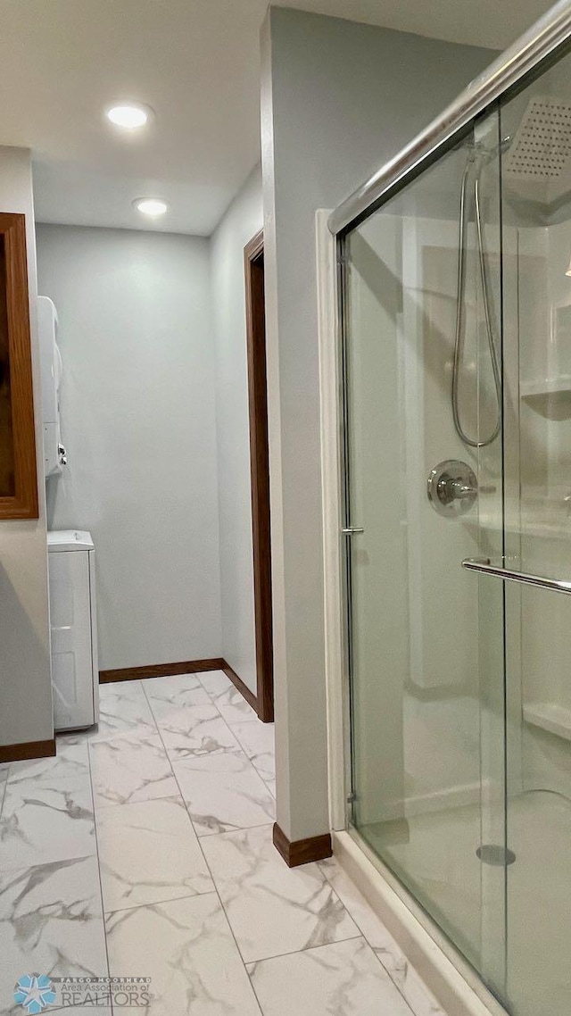 2440 15th St S Unit B14, Fargo, ND 58103 - full bath featuring washer / clothes dryer, a shower stall, marble look tile flooring, and recessed lighting