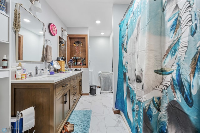 2440 15th St S Unit B14, Fargo, ND 58103 - full bathroom featuring double vanity, marble finish floors, curtained shower, and recessed lighting