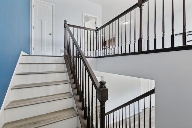 8949 Village Loop, Chanhassen, MN 55317 - stairway featuring a towering ceiling