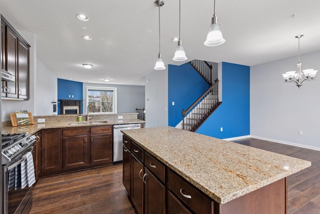 8949 Village Loop, Chanhassen, MN 55317 - kitchen featuring stainless steel appliances, dark wood finished floors, light stone counters, a chandelier, and dark brown cabinets
