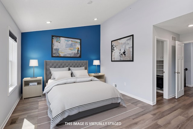 8949 Village Loop, Chanhassen, MN 55317 - bedroom featuring wood finished floors and recessed lighting