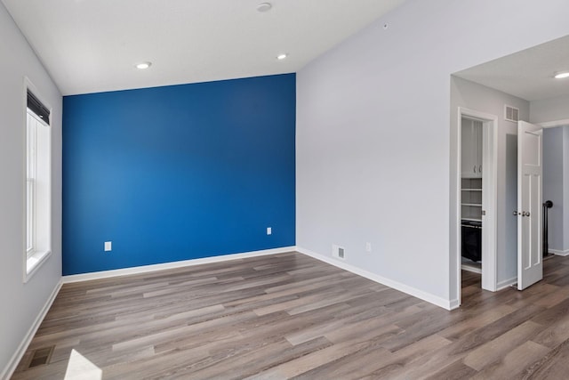 8949 Village Loop, Chanhassen, MN 55317 - unfurnished room with wood finished floors and recessed lighting