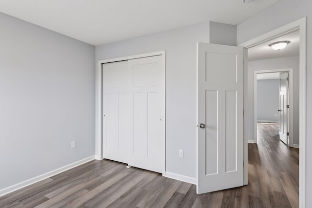 8949 Village Loop, Chanhassen, MN 55317 - unfurnished bedroom featuring dark wood finished floors and a closet