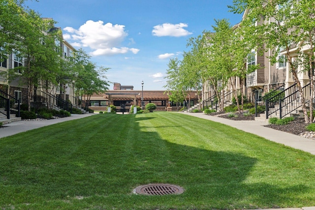 8949 Village Loop, Chanhassen, MN 55317 - view of community with a yard and stairs