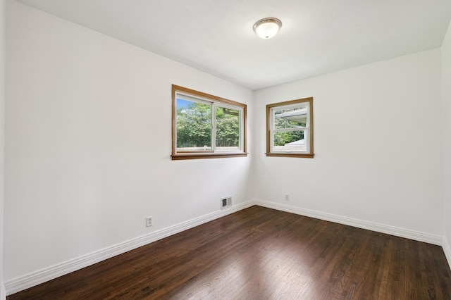 4337 Colorado Ave N, Crystal, MN 55422 - empty room with dark wood-style floors and baseboards