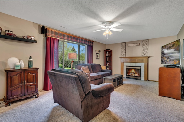 906 Cory Ln, Saint Cloud, MN 56303 - living area with light carpet, a ceiling fan, a fireplace, and a textured ceiling