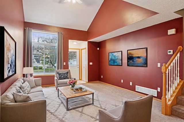 14220 Xenon St NW Unit 6Nw, Ramsey, MN 55303 - carpeted living area featuring a ceiling fan, stairway, and vaulted ceiling