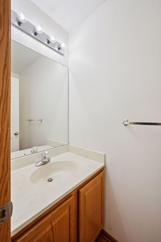 14220 Xenon St NW Unit 6Nw, Ramsey, MN 55303 - bathroom with vanity and a textured ceiling