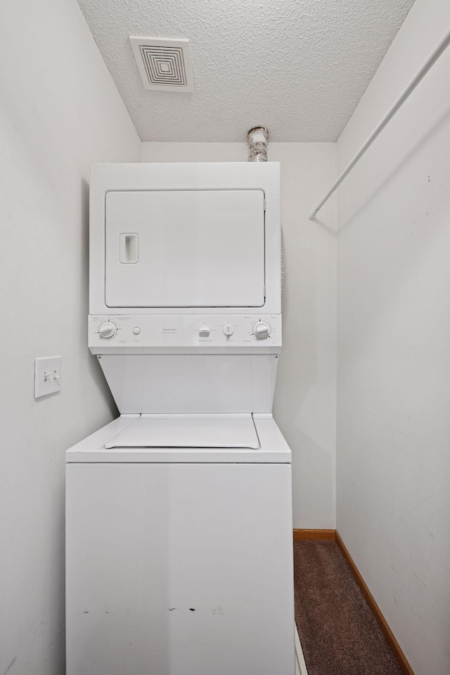 14220 Xenon St NW Unit 6Nw, Ramsey, MN 55303 - laundry room with stacked washer and clothes dryer, a textured ceiling, and carpet floors