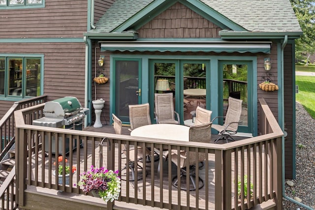34792 Shore Ln, Crosslake, MN 56442 - wooden terrace with area for grilling and outdoor dining area