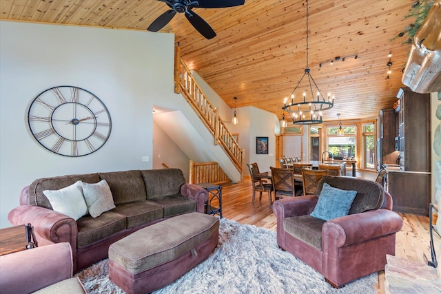 34792 Shore Ln, Crosslake, MN 56442 - living area with wooden ceiling, stairway, light wood-type flooring, a chandelier, and a ceiling fan