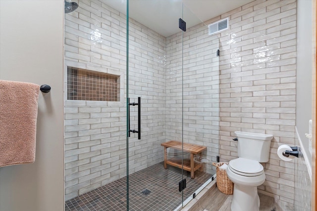 34792 Shore Ln, Crosslake, MN 56442 - full bath featuring a shower stall, wood finished floors, and tile walls