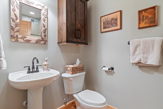 34792 Shore Ln, Crosslake, MN 56442 - half bathroom with toilet and baseboards