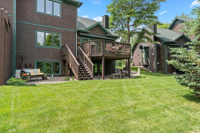 34792 Shore Ln, Crosslake, MN 56442 - rear view of property with a wooden deck, stairway, a lawn, and a chimney
