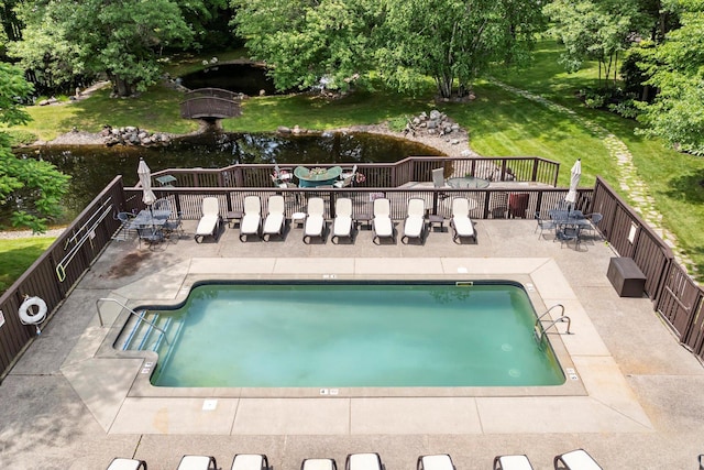 34792 Shore Ln, Crosslake, MN 56442 - community pool featuring a patio area, a lawn, and view of wooded area