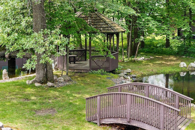 34792 Shore Ln, Crosslake, MN 56442 - view of green lawn featuring a deck with water view