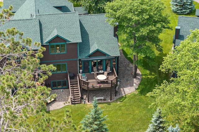 34792 Shore Ln, Crosslake, MN 56442 - rear view of property featuring a shingled roof, a wooden deck, stairway, and a lawn