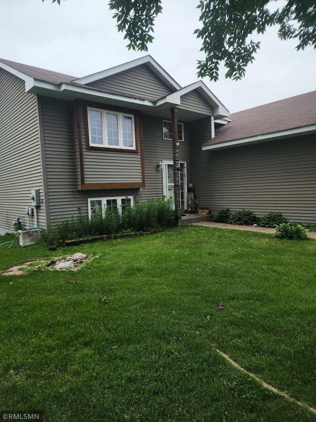 419 Cardinal Ct, Isanti, MN 55040 - view of front of house with a front yard and roof with shingles