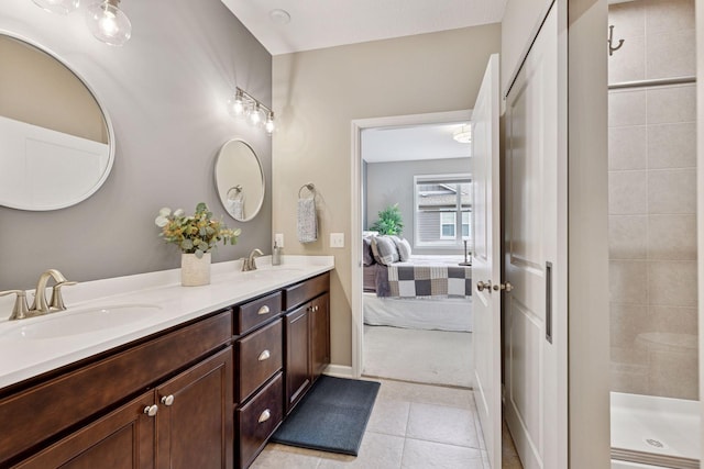 5053 Sunstream Ln, Woodbury, MN 55129 - full bathroom with double vanity, ensuite bath, tile patterned floors, and tiled shower