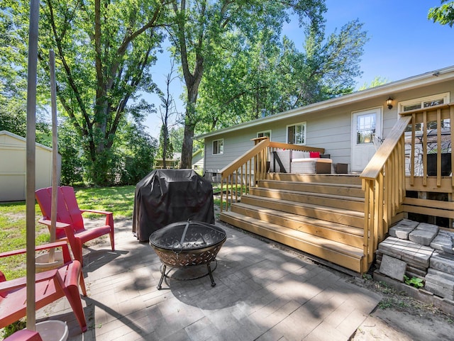 832 10th Ave SE, Forest Lake, MN 55025 - view of patio / terrace featuring an outdoor fire pit, area for grilling, stairs, a deck, and a shed