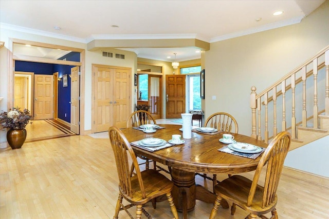 2719 Spring Lake Rd SW, Prior Lake, MN 55372 - dining space featuring light wood-type flooring, stairway, and crown molding