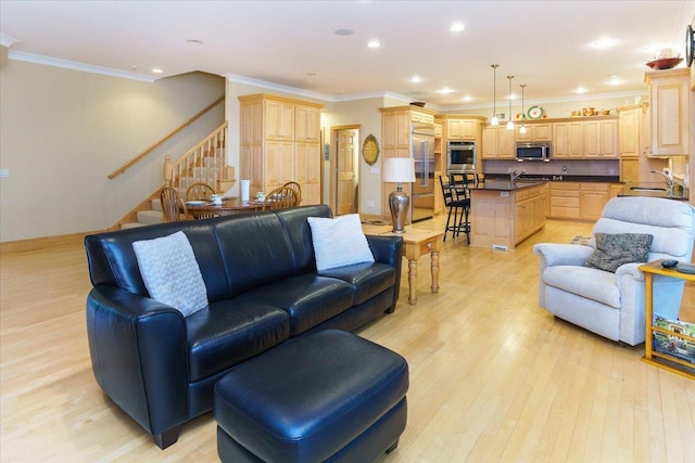 2719 Spring Lake Rd SW, Prior Lake, MN 55372 - living area with stairway, light wood-type flooring, crown molding, and recessed lighting
