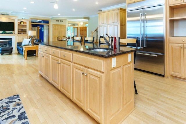 2719 Spring Lake Rd SW, Prior Lake, MN 55372 - kitchen featuring stainless steel built in fridge, crown molding, light brown cabinets, light wood-style floors, and an island with sink