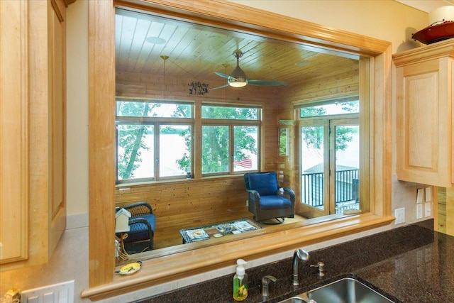 2719 Spring Lake Rd SW, Prior Lake, MN 55372 - kitchen with ceiling fan, light brown cabinetry, wood ceiling, and dark stone counters