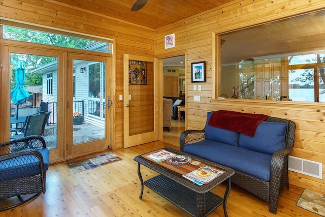 2719 Spring Lake Rd SW, Prior Lake, MN 55372 - living room featuring wood-type flooring, wood walls, wooden ceiling, and a ceiling fan