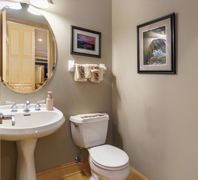 2719 Spring Lake Rd SW, Prior Lake, MN 55372 - half bath featuring baseboards and wood finished floors