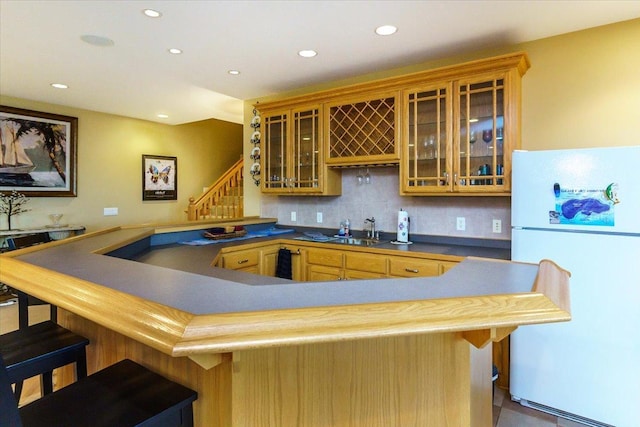 2719 Spring Lake Rd SW, Prior Lake, MN 55372 - indoor wet bar featuring freestanding refrigerator, recessed lighting, backsplash, and stairs
