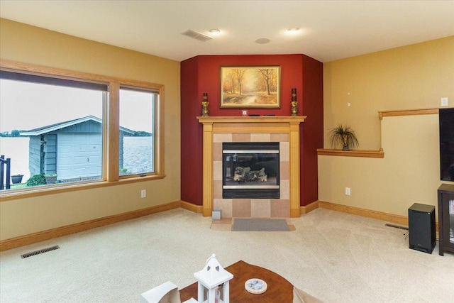 2719 Spring Lake Rd SW, Prior Lake, MN 55372 - unfurnished living room with carpet floors and a tiled fireplace