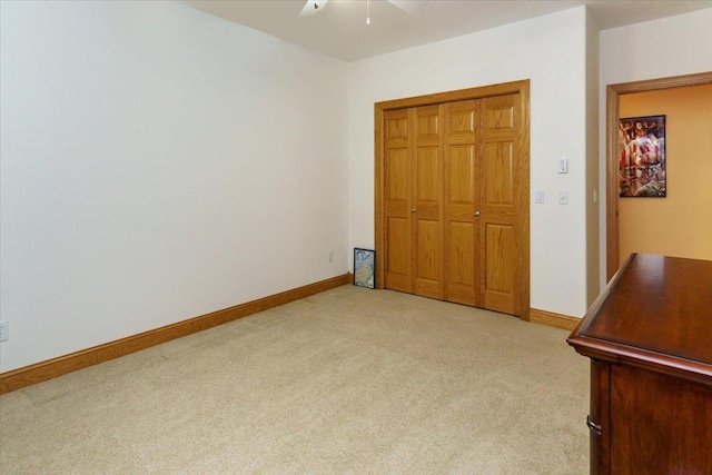 2719 Spring Lake Rd SW, Prior Lake, MN 55372 - unfurnished bedroom featuring light colored carpet, a closet, and a ceiling fan