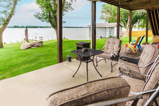 2719 Spring Lake Rd SW, Prior Lake, MN 55372 - view of patio / terrace featuring a water view and an outbuilding