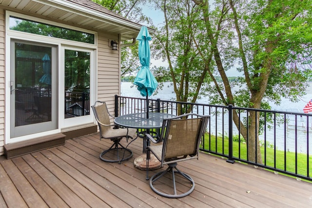 2719 Spring Lake Rd SW, Prior Lake, MN 55372 - wooden terrace with outdoor dining area and a water view