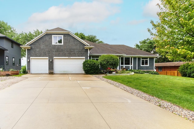 2719 Spring Lake Rd SW, Prior Lake, MN 55372 - view of front of house with driveway, a front yard, and an attached garage