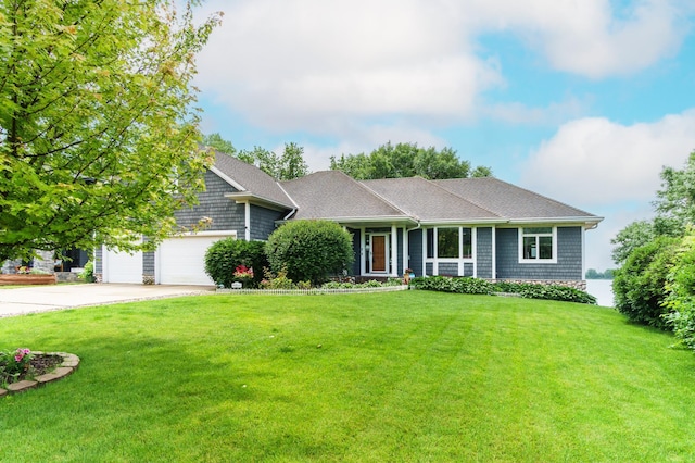 2719 Spring Lake Rd SW, Prior Lake, MN 55372 - view of front of home with concrete driveway, a front lawn, a shingled roof, and an attached garage