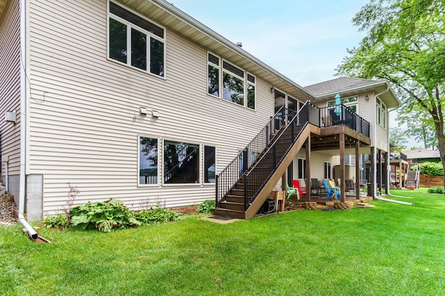2719 Spring Lake Rd SW, Prior Lake, MN 55372 - rear view of property featuring stairway, a yard, and a wooden deck