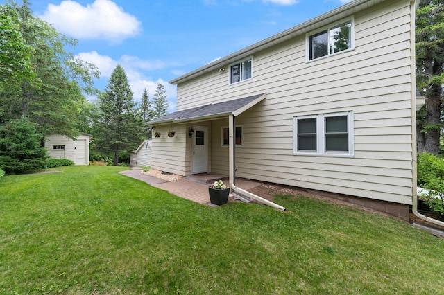 1921 Minneapolis Ave, Duluth, MN 55803 - back of property with a lawn, an outdoor structure, and a patio
