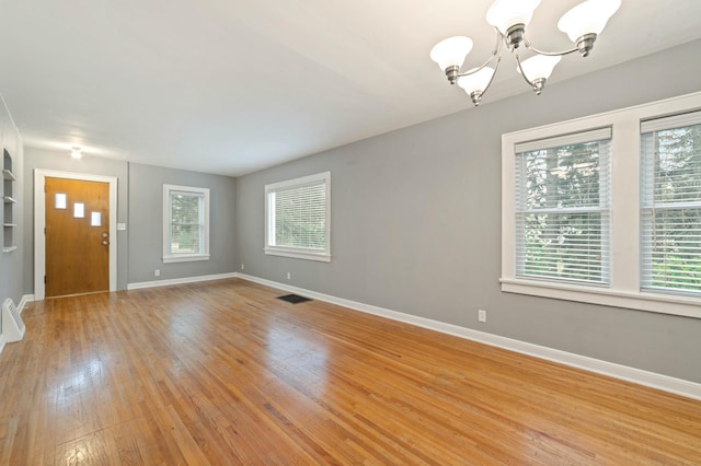 1921 Minneapolis Ave, Duluth, MN 55803 - entrance foyer featuring a chandelier and light wood-type flooring